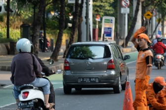Road Workers in Bright Orange,Jakarta, Java, Indonesia